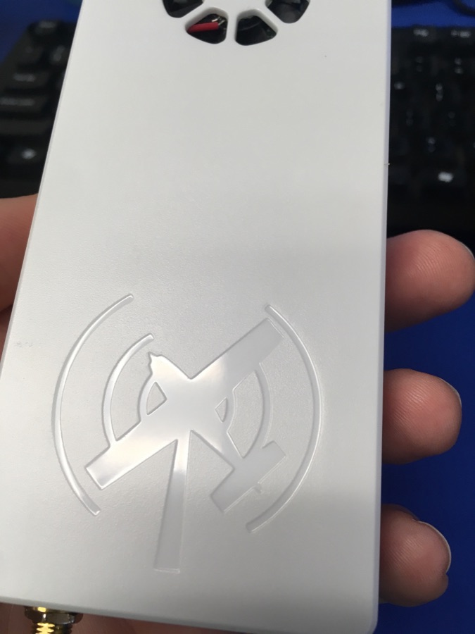 A Stratux receiver in its white case with two antennas